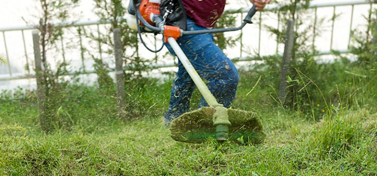 Weed trimmer being used at Legacy Small Engines